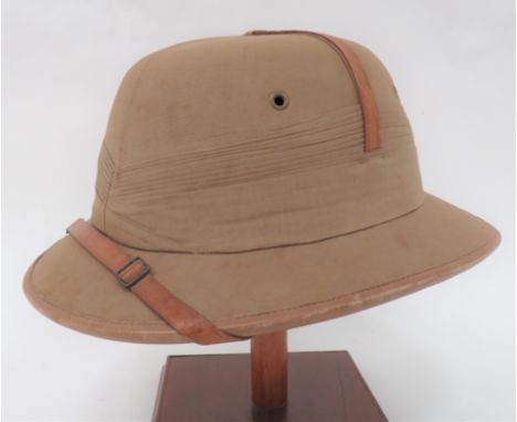 Interwar Khaki "Bombay Bowler" Pith Helmet khaki cotton, four panel, low dome crown. &nbsp;Rounded brim with leather edging. 