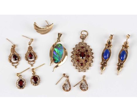 A group of jewellery, comprising a 9ct gold and garnet oval pendant, length 3cm, a gold and opal doublet pendant, length 3.5c