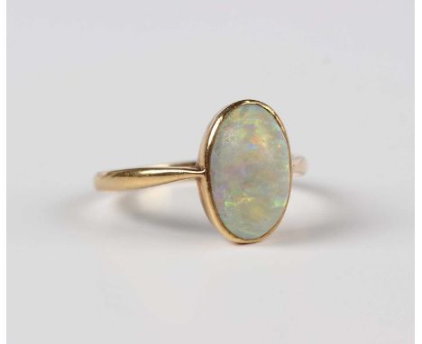A gold ring, mounted with an oval opal, detailed '18ct', weight 2.7g, ring size approx M, with a case.