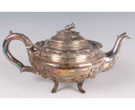 A William IV silver teapot of squat circular form, the domed hinged lid with thistle finial above a rim cast with flowers and