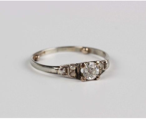 A diamond ring, claw set with a cushion shaped diamond between rose cut diamond two stone shoulders, indistinct marks, weight