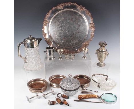 A 19th century plated circular tray, engraved with flowers and scrolls within a cast fruiting vine rim, diameter 41cm, and a 