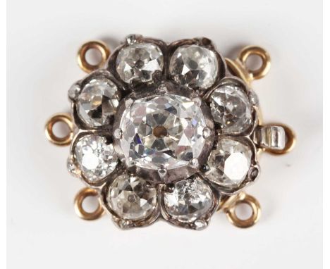 A gold and silver set diamond cluster clasp, mounted with the principal old cut cushion shaped diamond within a surround of e
