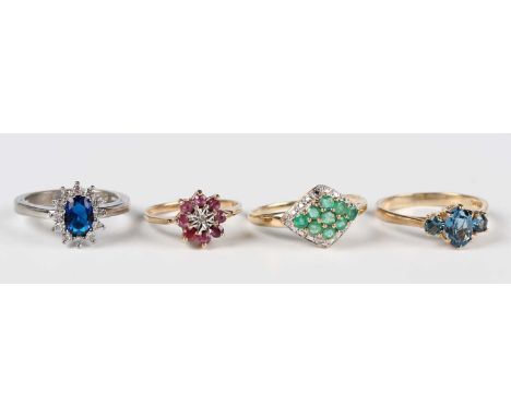 A 9ct gold, emerald and diamond marquise shaped cluster ring, mounted with nine circular cut emeralds and four circular cut d