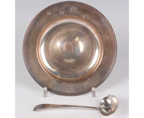 An Elizabeth II silver circular dish, Sheffield 1993 by Carrs of Sheffield Ltd, diameter 15cm, and a George III silver sauce 