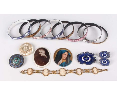 A silver and enamelled circular brooch of Celtic design, Birmingham 1944, diameter 4cm, a gilt metal and shell cameo bracelet