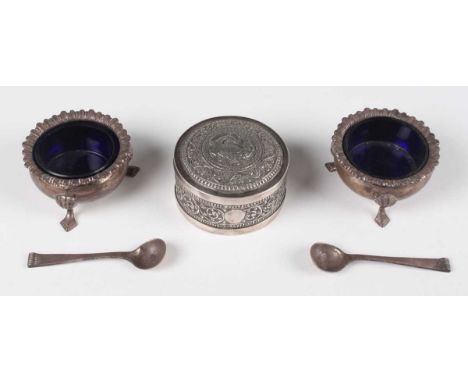 A late 19th/early 20th century Indian silver circular box and cover, probably Lucknow, the top chased with a bird within scro