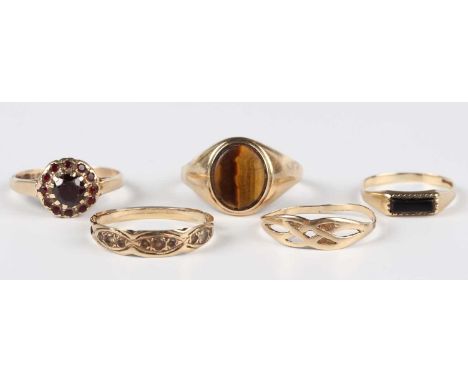 A 9ct gold and garnet cluster ring, Birmingham 1971, ring size approx R, a gold and tiger's eye signet ring, ring size approx