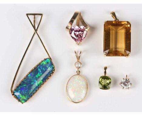 A 9ct gold mounted oval opal and cultured pearl pendant, length 3cm, a gold and citrine single stone pendant, an opal triplet