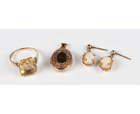 A 9ct gold and citrine single stone ring, London 1963, ring size approx I1/2, a 9ct gold oval pendant locket with engraved de