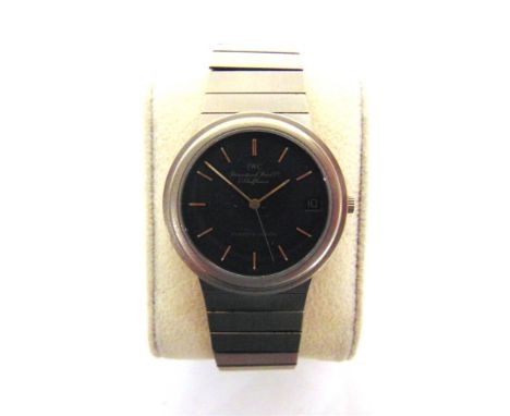 A PORSCHE DESIGN WRISTWATCH, BY I.W.C.  The black face with baton hour markers and date aperture at 3, the titanium case 32mm