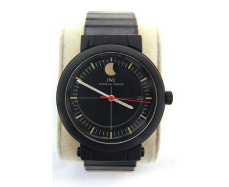 A PORSCHE DESIGN 3551 AUTOMATIC COMPASS WRISTWATCH, BY I.W.C.  serial number 2457891, the black face with baton hour markers,