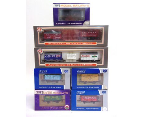 [OO GAUGE]. SEVEN LIMITED EDITION WAGONS BY DAPOL comprising a West Wales Wagon Works lime wagon and seven-plank open wagon s