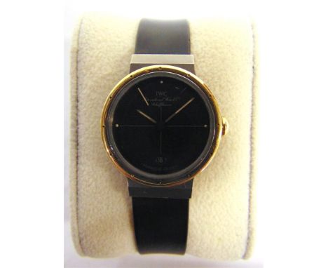 A PORSCHE DESIGN LADY'S WRISTWATCH, BY I.W.C.  the black face with date aperture at 6, the titanium and yellow gold case 25mm