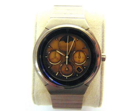 A PORSCHE DESIGN WRISTWATCH, BY I.W.C.  serial number 2628257, the gold face with baton hour markers, subsidiary dials, and d