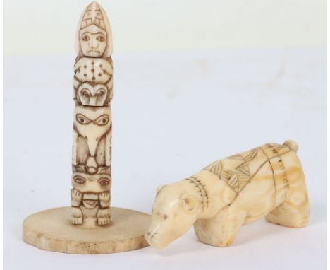 Inuit walrus tusk spear rest in the form of a bear with incised geometric decoration, 7cm; and a similar totem 8cm tall carve