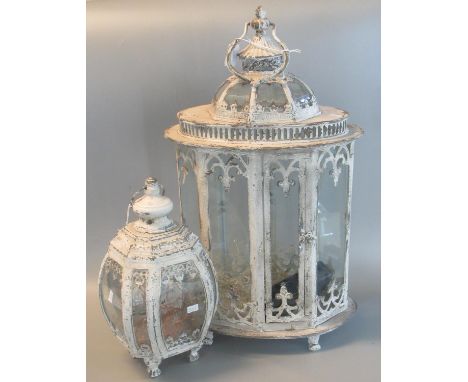 Modern shabby chic design metal and glass lantern, together with a similar smaller hanging lanters. Largest is 63cm high appr