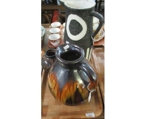 Three pieces of Art Pottery to include: large brown drip glaze jug, black and white rough finish, unglazed, abstract design p