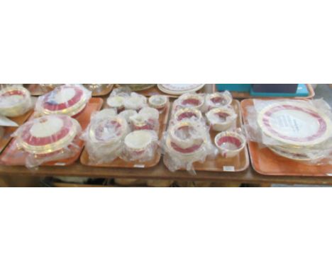 Five trays of Wedgwood 'Whitehall' ruby and gilt dinnerware to include: six dinner plates, six soup bowls and saucers, six si