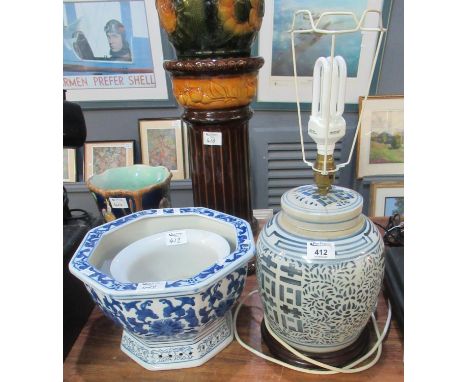 Three Oriental style blue and white ceramic items to include octagonal planter and another plants, with a baluster table lamp