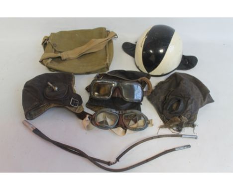 THREE LEATHER FLYING HELMETS, (one by D Lewis, Oxford Street, London), a later Campbell "No11" crash helmet, two pairs of gog