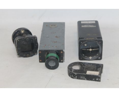 AN RAF WILLIAMSON CAMERA TYPE G45 with magazine and spare, a US Pioneer panel compass and a Military Flight System Director H