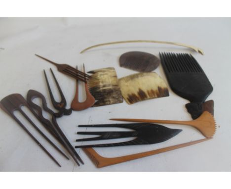 AN UNUSUAL LARGE TRIBAL ART OCEANIC CARVED BONE HAIR COMB along with further combs from Africa, Asia and South America