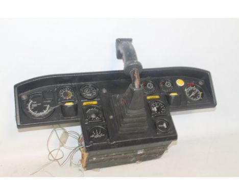 AN INSTRUMENT PANEL AND JOYSTICK, possibly from a flight simulator
