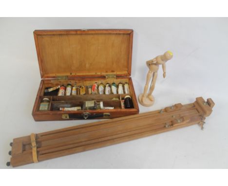 A VINTAGE ARTISTS EASEL, together with a collection of oils in wooden cases and a mannequin