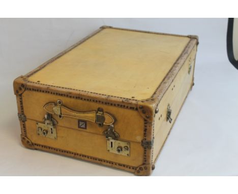 A VINTAGE VELLUM COVERED TRAVEL TRUNK, with fitted green cloth interior, maker tag for "Watajoy"