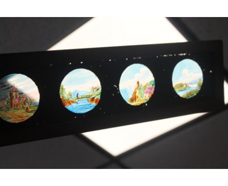 FOURTEEN 14" HAND PAINTED MAGIC LANTERN SLIDE STRIPS together with a mechanical example