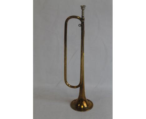 A BRASS BUGLE WITH WHITE METAL MOUTH PIECE
