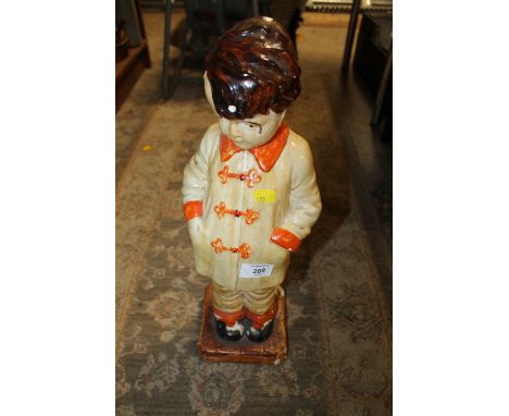 A LARGE VINTAGE CERAMIC FIGURE OF A BOY