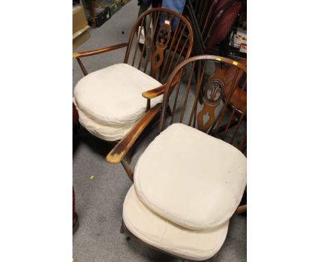 A PAIR OF ERCOL HOOP BACKED ARMCHAIRS