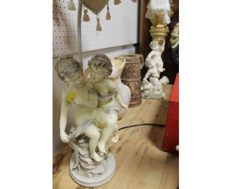 A FIGURATIVE LAMP & SHADE, TWO JUGS & A FIGURATIVE ORNAMENT (4)