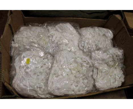 A BOX OF 12 X BAGS OF VINTAGE WHITE SATIN SUSPENDER BELTS, EACH BAG CONTAINING APPROX 10