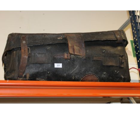 A LARGE VINTAGE LEATHER SUITCASE