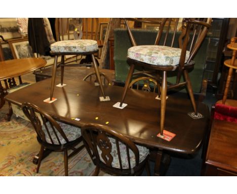 AN ERCOL DARK OAK REFECTORY TABLE + SIX CHAIRS