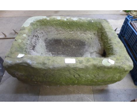 A reconstituted stone garden trough