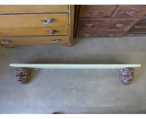 A gargoyle coat rack/shelf