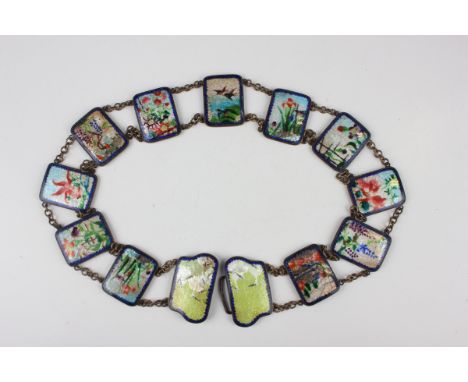 A Japanese ginbari cloisonné enamel belt, early 20th century, the pair of buckles decorated with cranes on a yellow ground, t