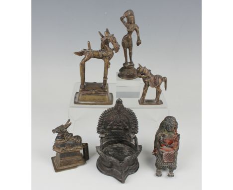 A group of six South Indian bronzes, mostly 19th century, including a figure of Parvati, height 13.6cm, a Nandi bull, height 
