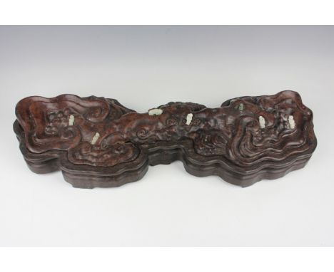 A Chinese hardwood carving, probably 20th century, modelled as a gnarled lingzhi fungus, inset with miniature jade figures an