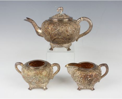 A Chinese export silver three-piece tea set by Wang Hing &amp; Co of Hong Kong, late 19th/early 20th century, comprising teap