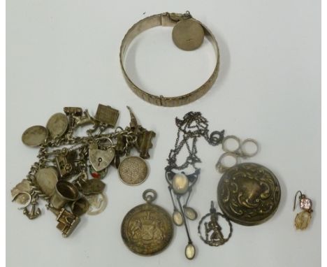 SILVER CURB PATTERN CHARM BRACELET, hung with approx 26 silver charms, including Blackpool Tower, Laxey Wheel, two churches, 