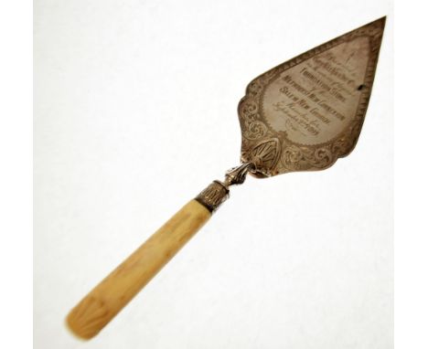 LATE VICTORIAN ENGRAVED SILVER PRESENTATION TROWEL, with carved ivory handle, the diamond shaped blade with nine line inscrip