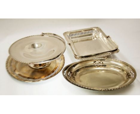 TWO ELECTROPLATED SWING HANDLED CAKE BASKETS, one of circular, pedestal form with bobbin and reel border, the other of oblong