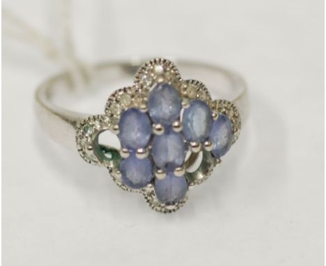 14k GOLD RING set with a cluster of seven oval pale blue gem stones (two missing) and wavy surround set with tiny white stone