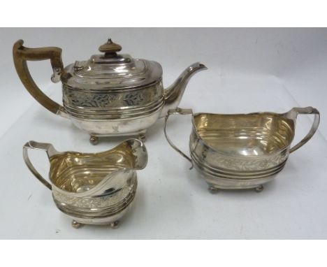 SILVER GEORGE III STYLE BULBOUS OBLONG TEA SERVICE with broad engraved band over a triple ribbed girdle, on ball feet, viz te