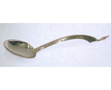 EARLY TWENTIETH CENTURY PROBABLY PERSIAN SILVER COLOURED METAL SERVING SPOON, with lightly planished ovoid bowl, ridged long 